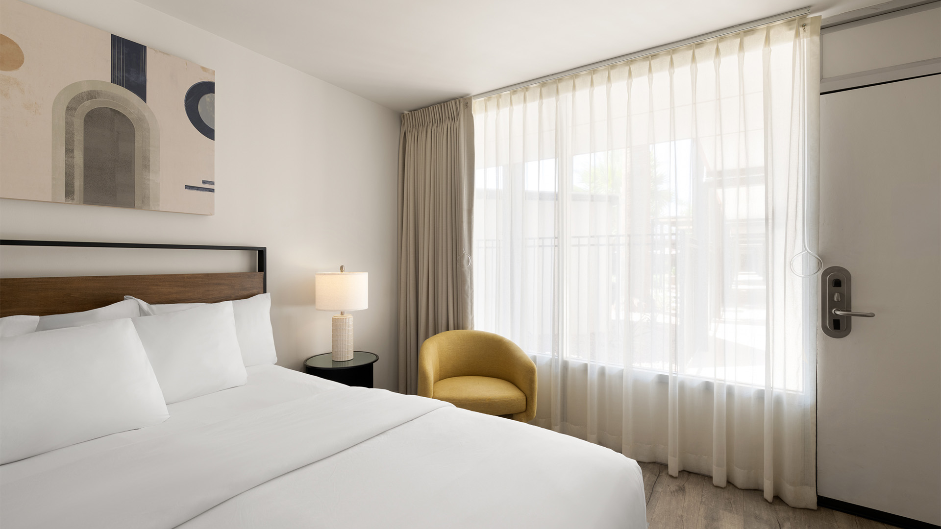 a bedroom with a bed and a chair