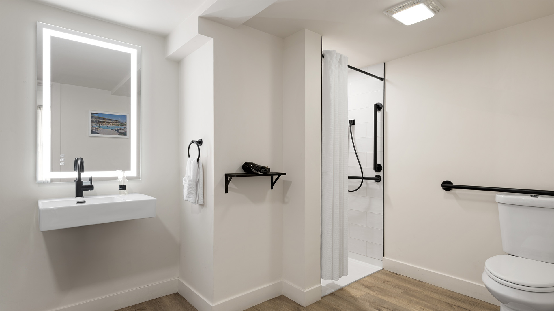 a bathroom with a shower and a sink