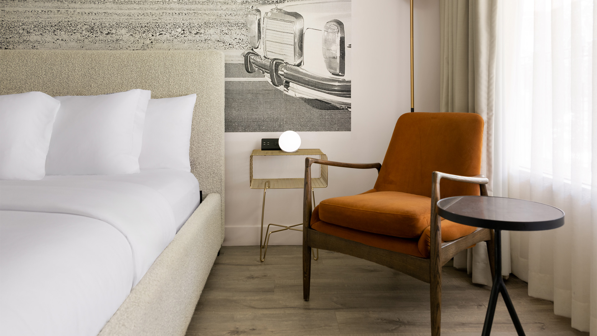 a chair next to a bed