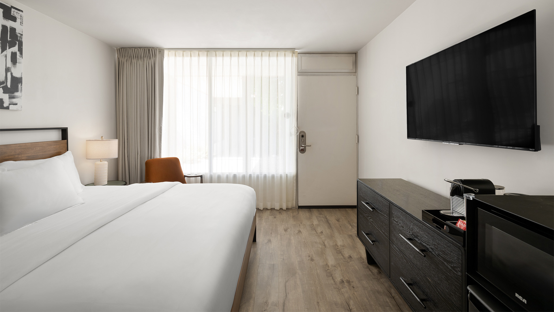 a bedroom with a tv and a bed