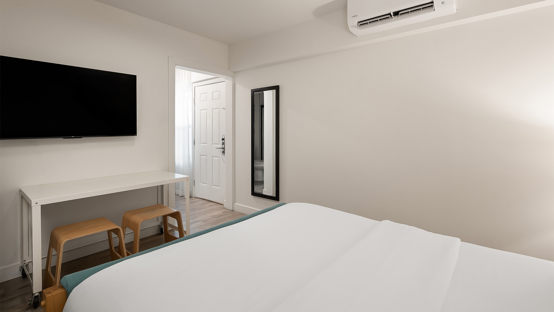 a room with a bed and a desk