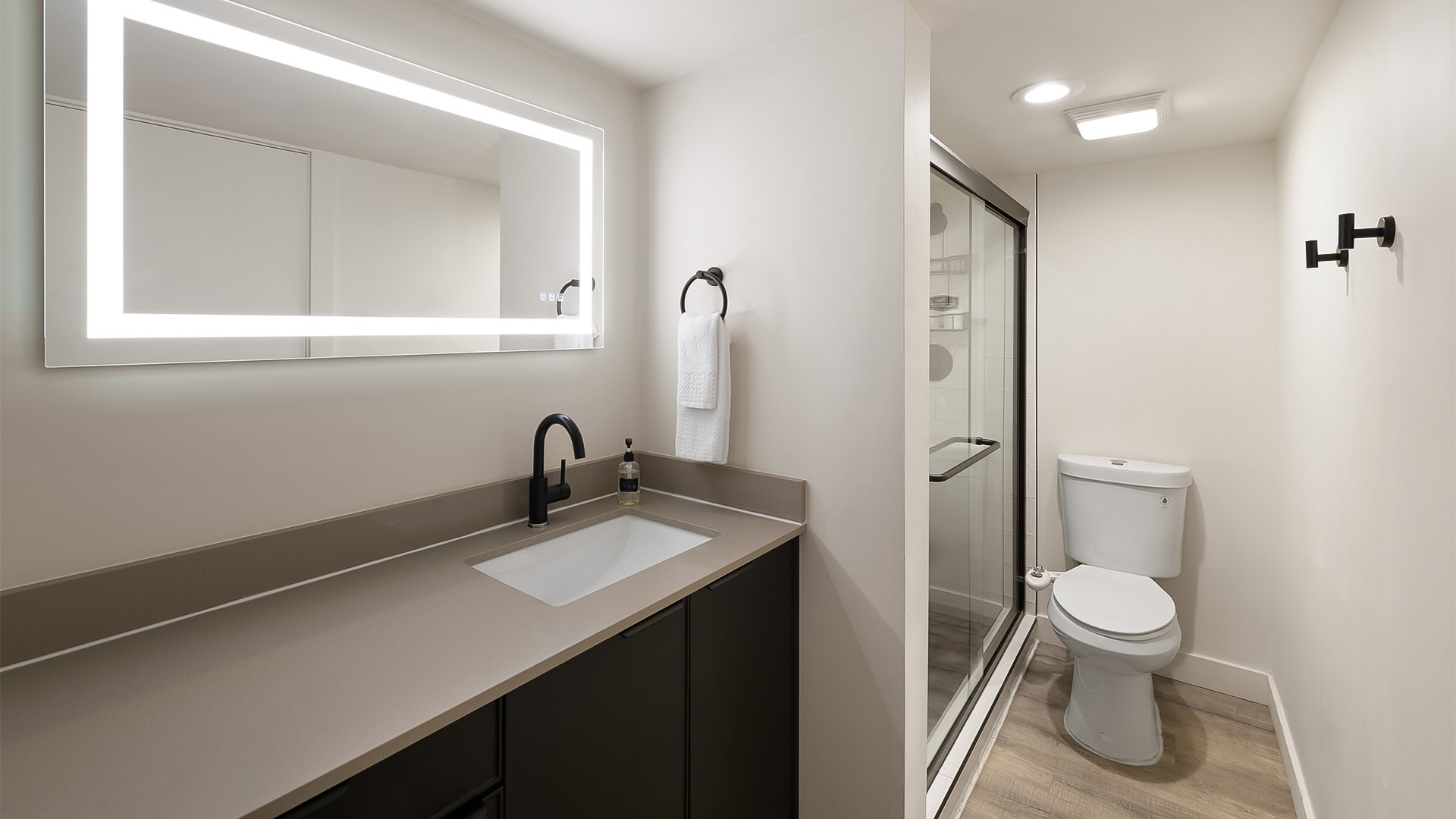 a bathroom with a mirror and sink