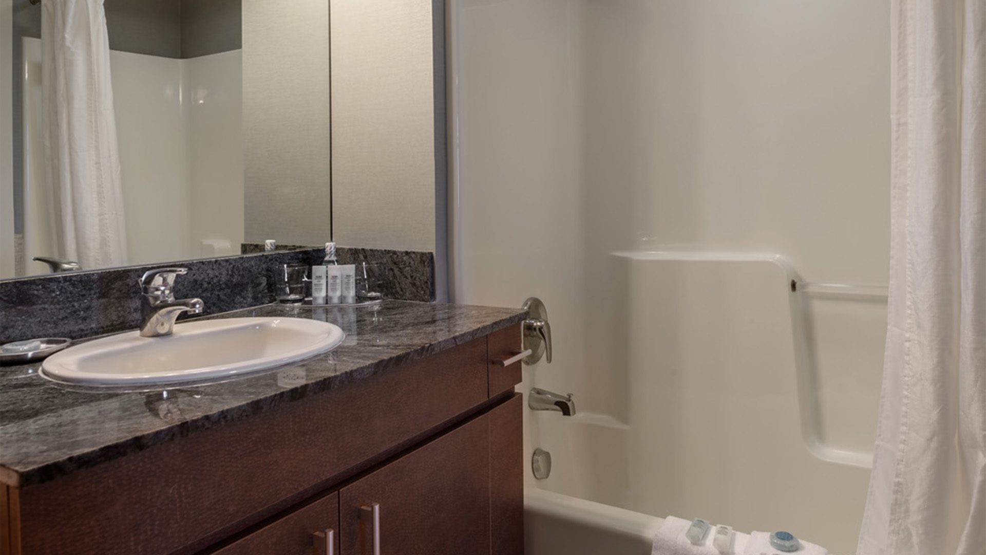 a bathroom with a bathtub and sink