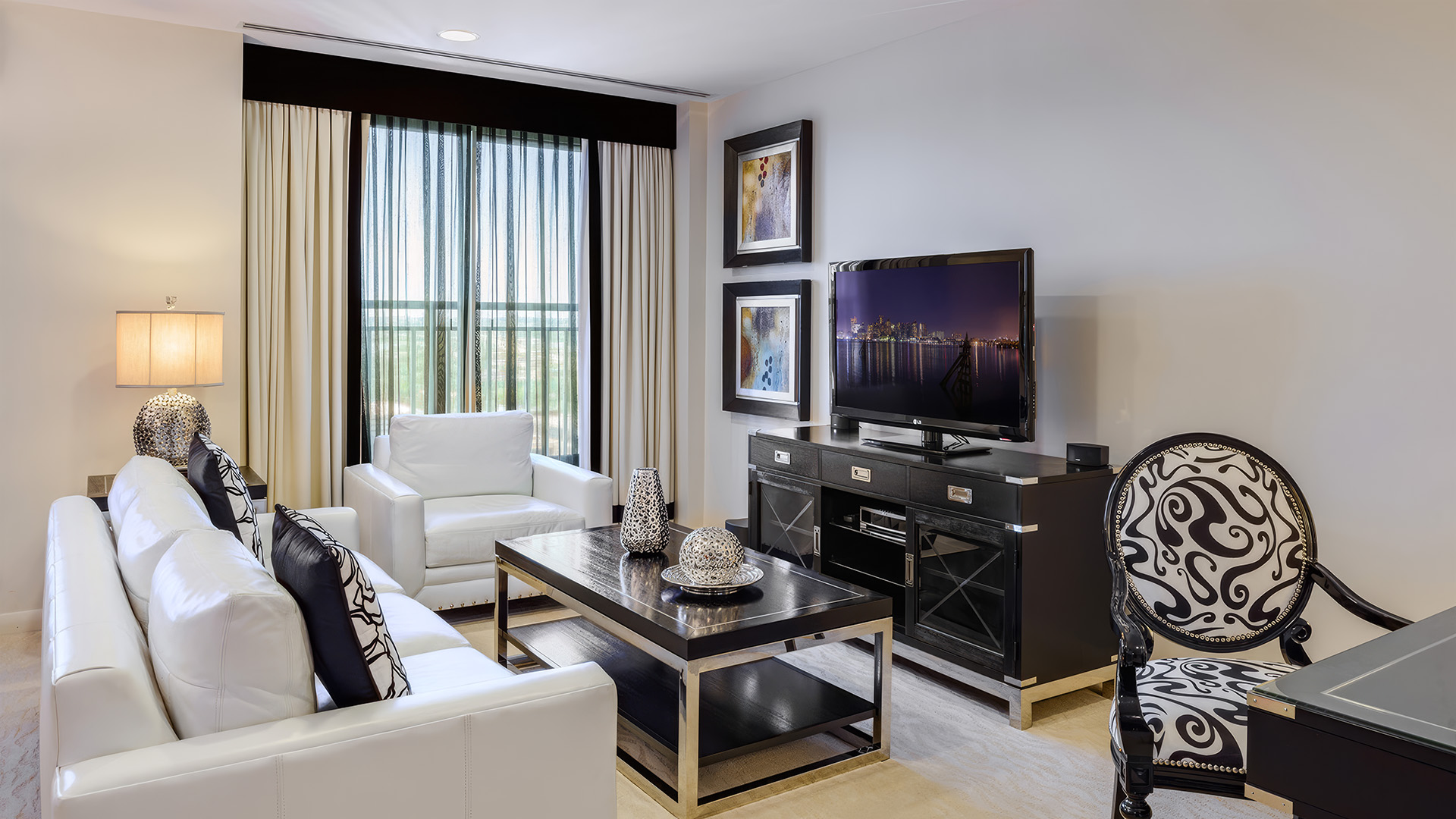 a living room with a tv and a table