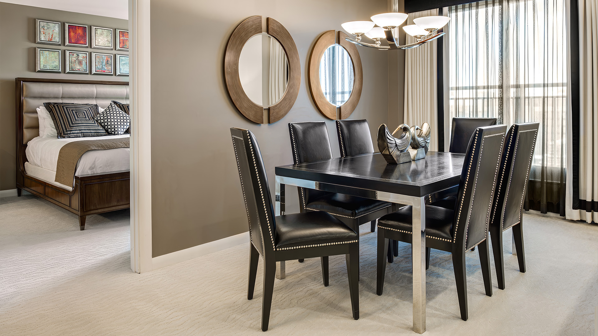 a dining table and chairs in a room