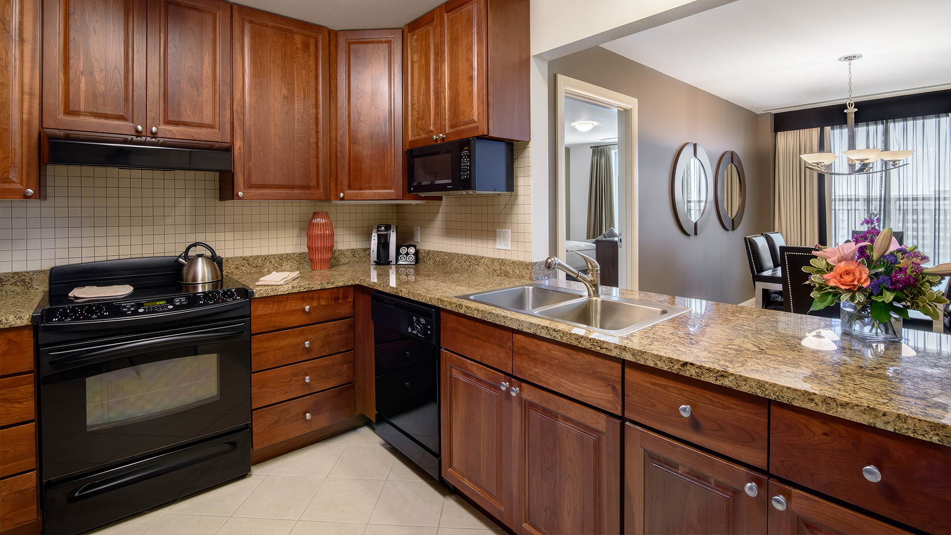 a kitchen with granite counter tops and a sink