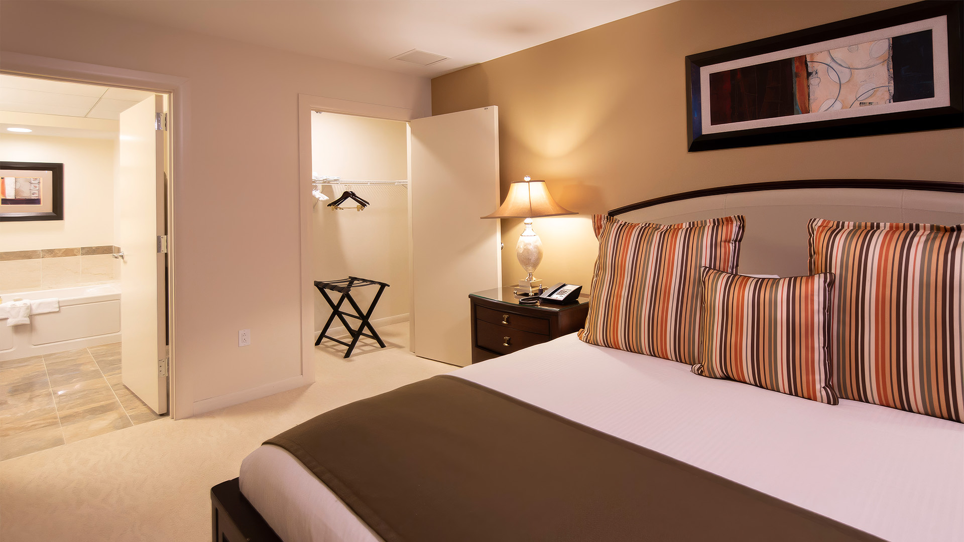 a bedroom with a bed and a closet