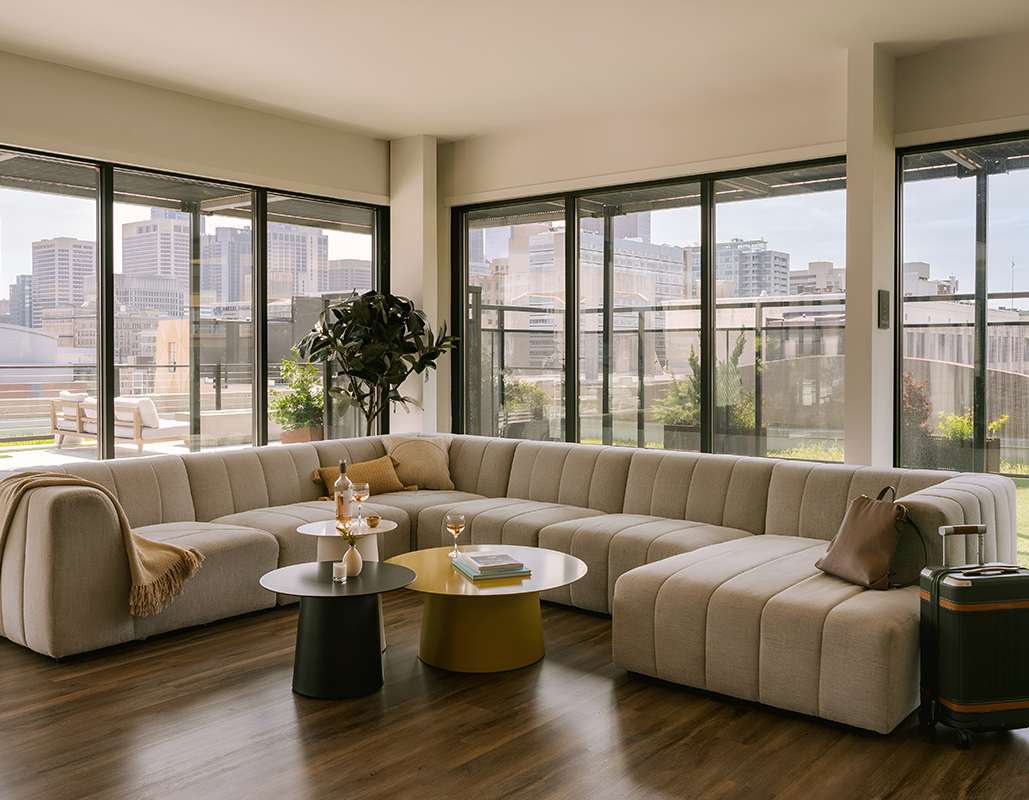 a living room with a large couch and a table