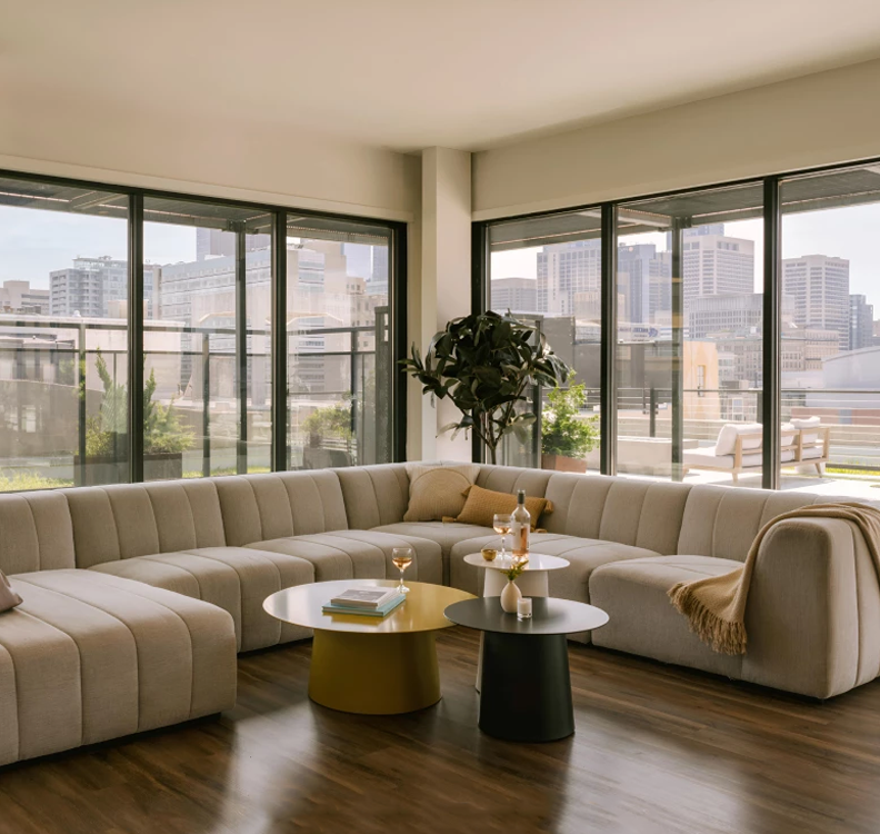 a living room with a large couch and a table