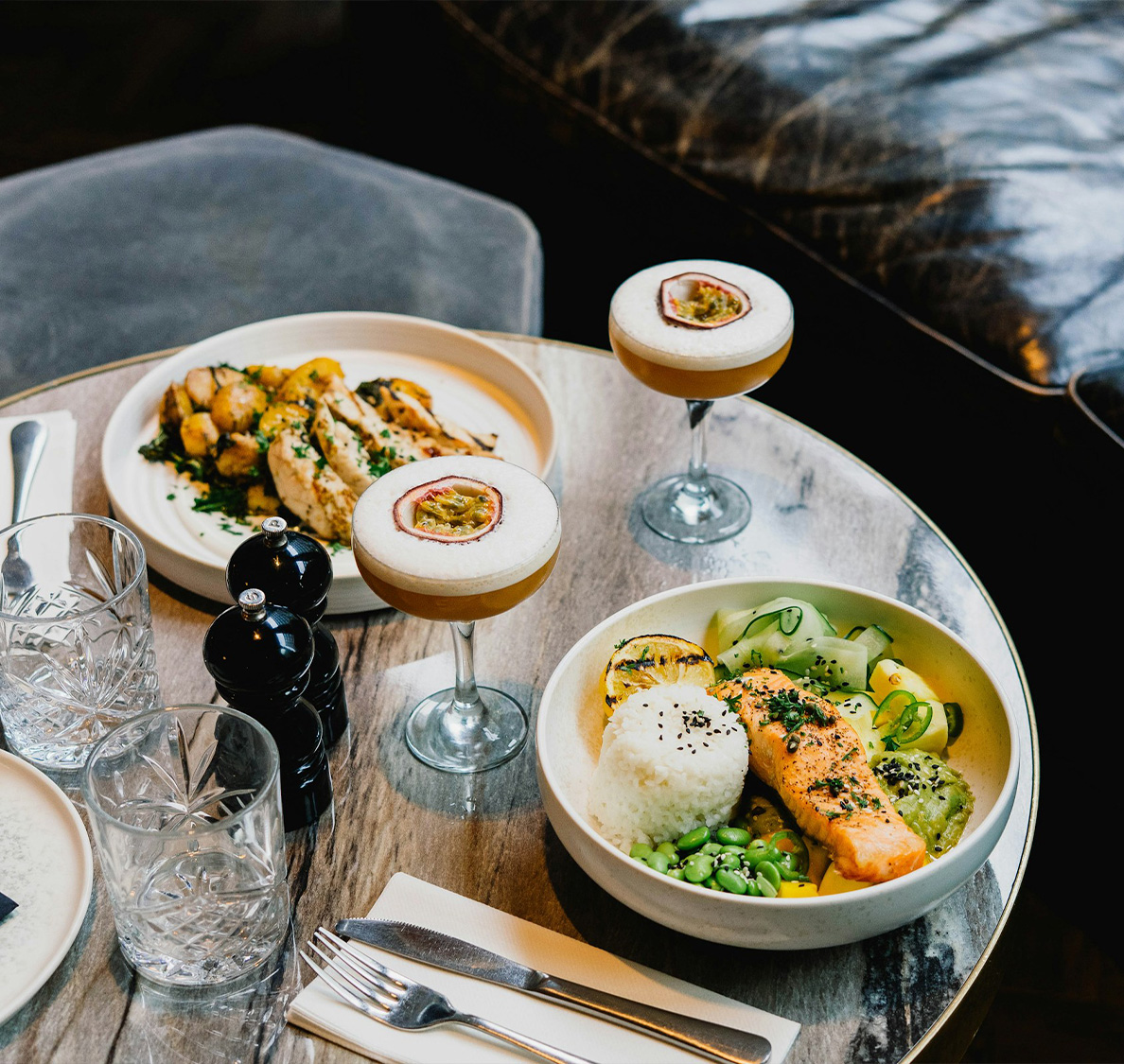a table with plates of food and drinks