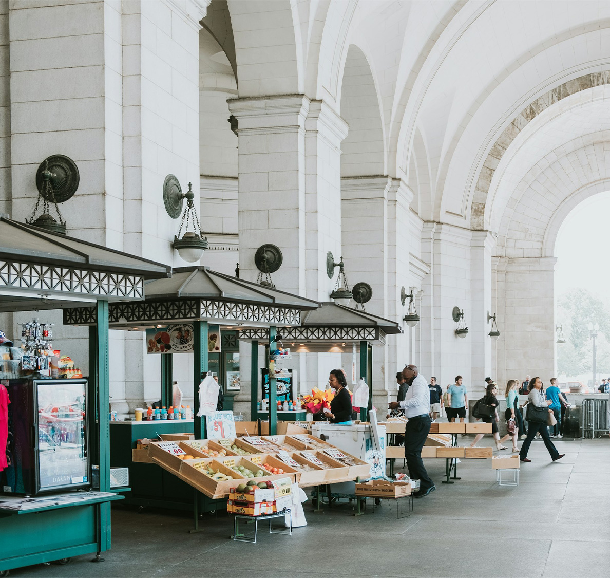 people walking in a market