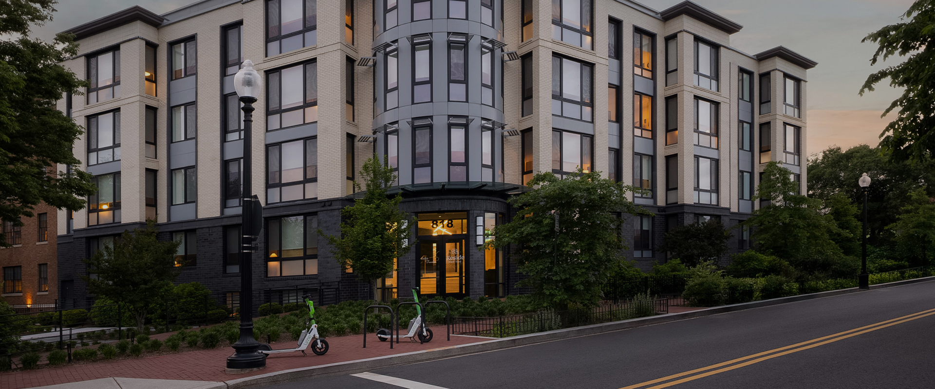 a building with a bike rack and scooters