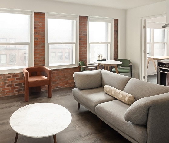 a living room with a couch and chairs