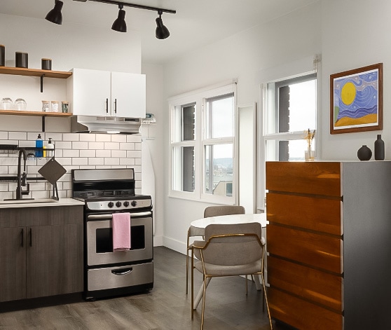 a kitchen with a table and chairs