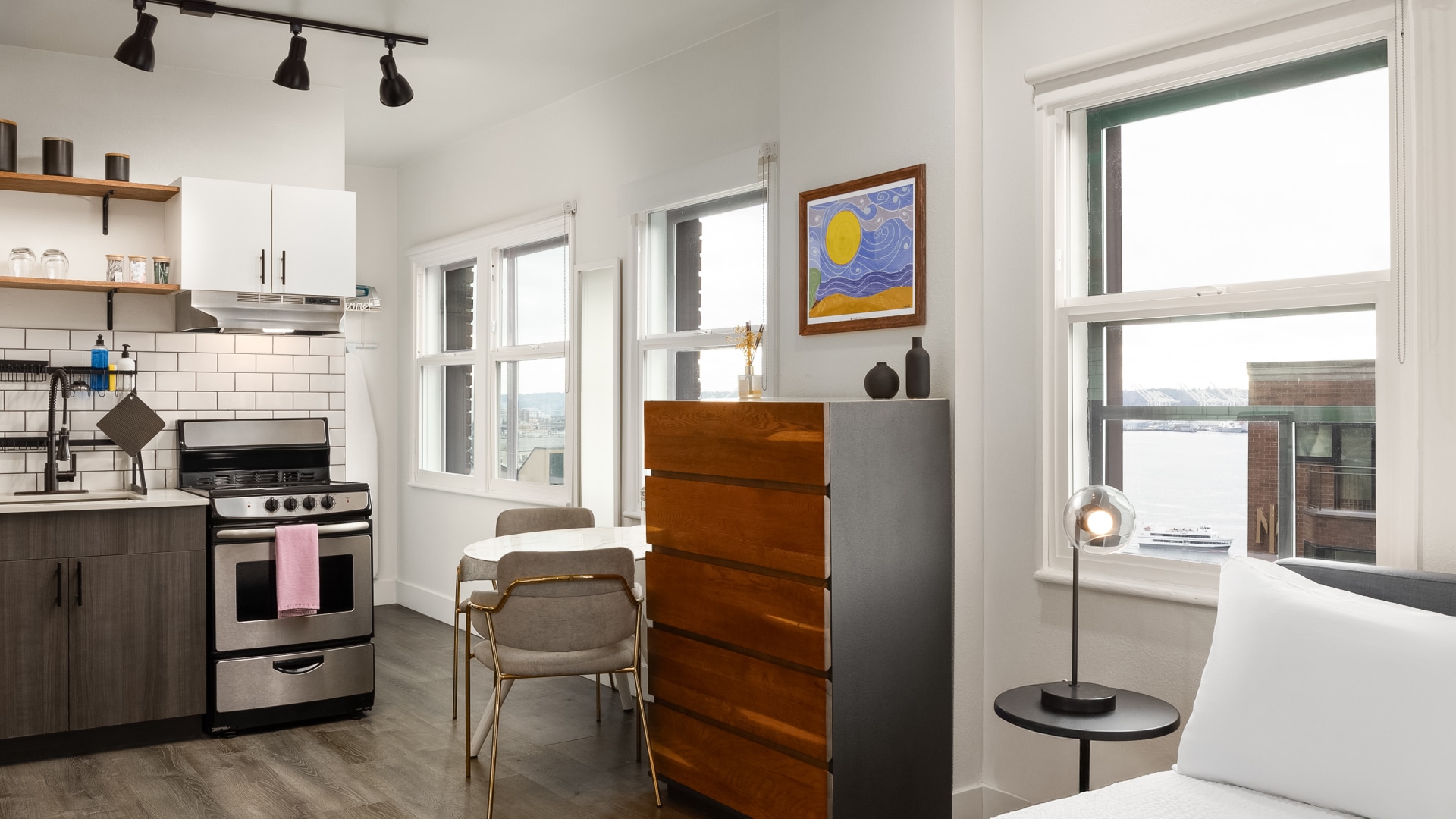 a kitchen with a table and chairs