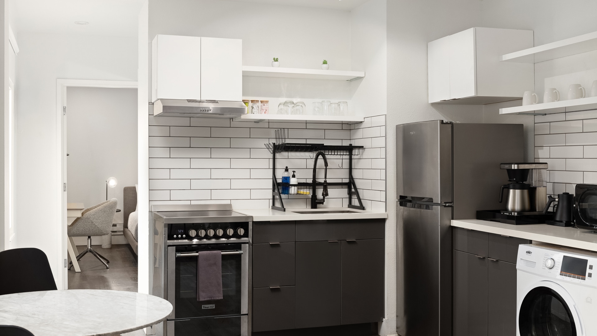 a kitchen with a sink and refrigerator