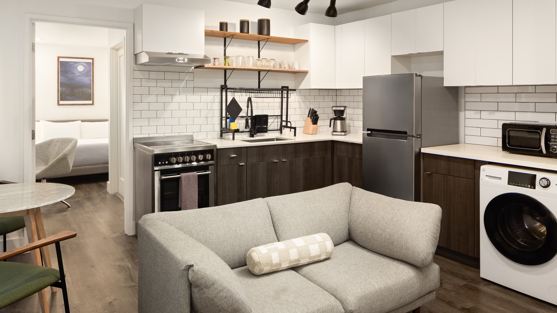 a kitchen with a couch and appliances