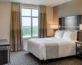 a hotel room with a large bed