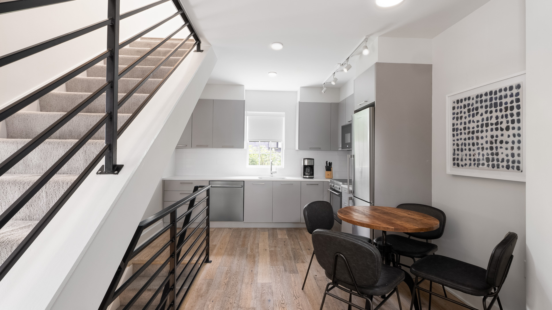 a kitchen with a table and chairs