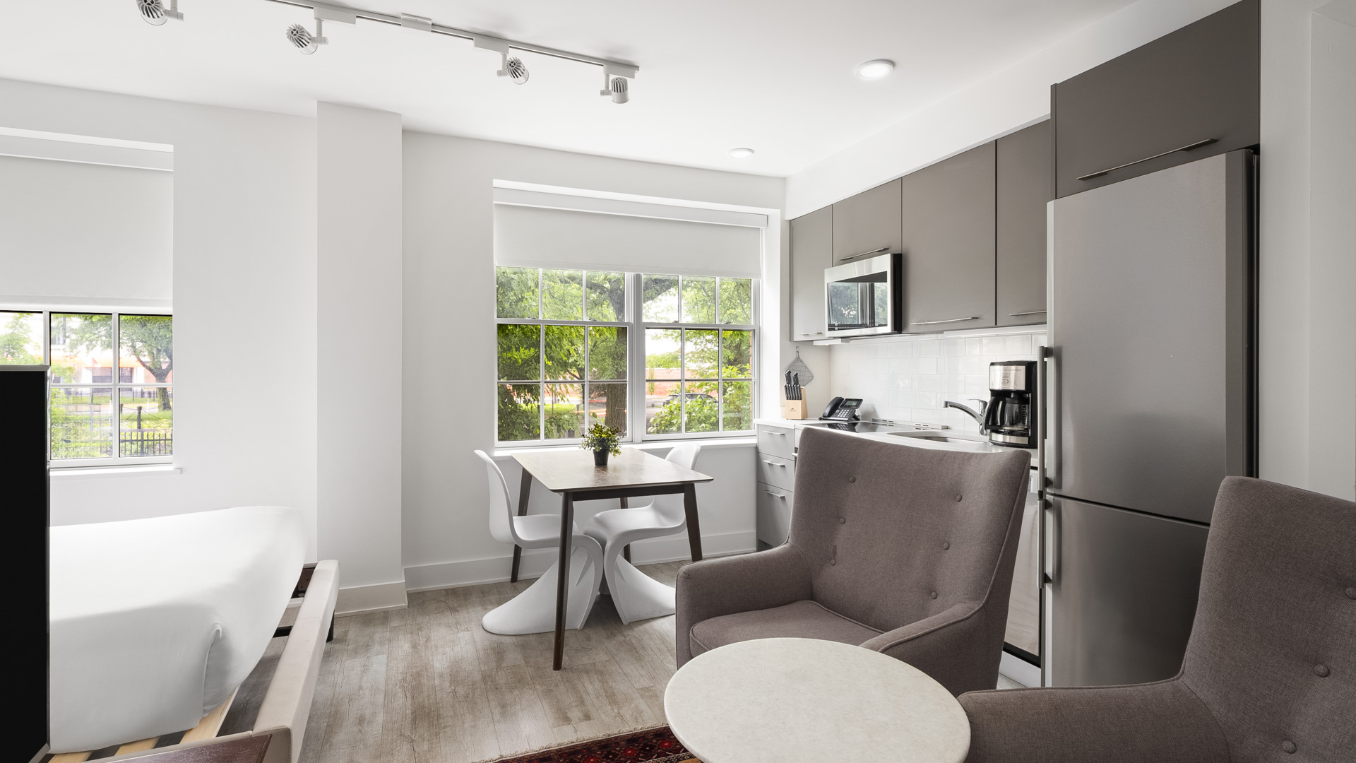 a kitchen and dining area with a table and chairs