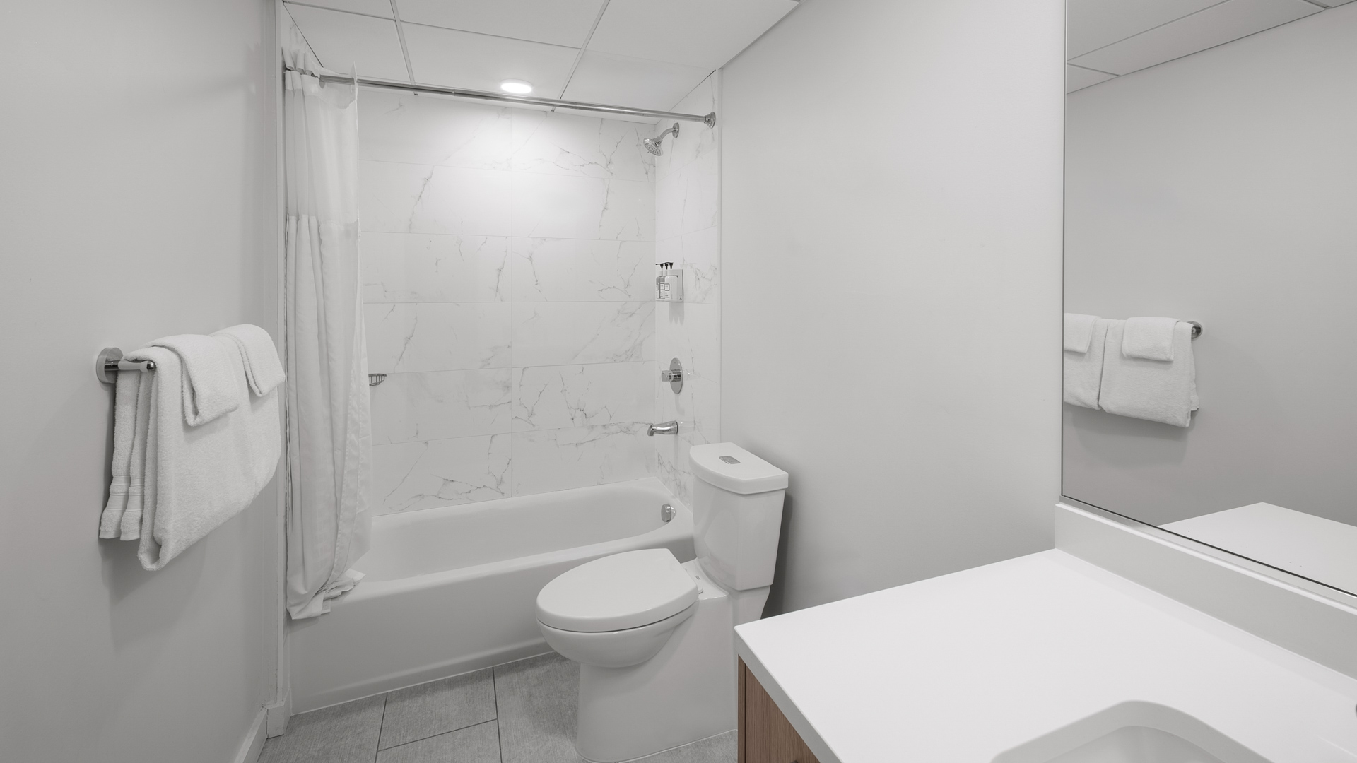 a bathroom with a toilet and tub