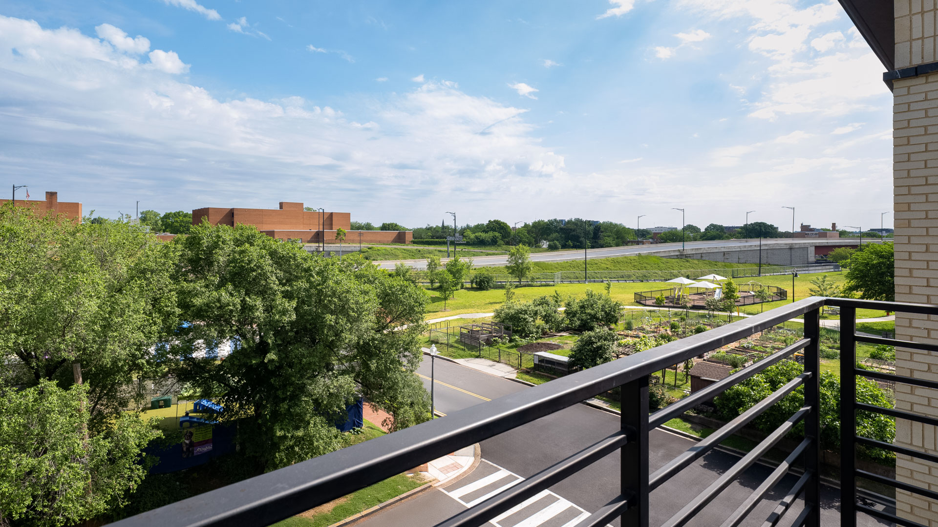 a view of a park from a balcony
