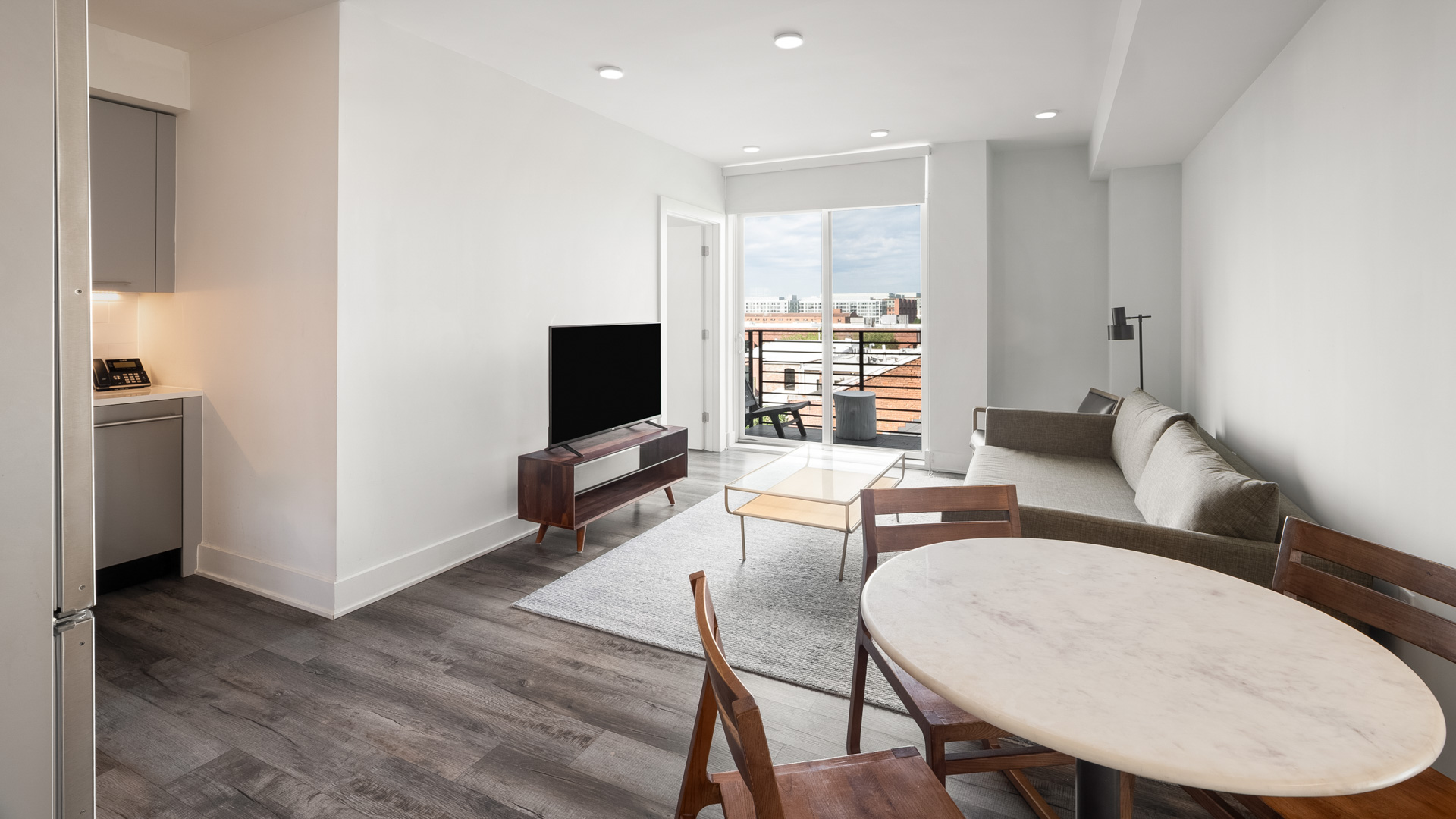 a living room with a television and a table