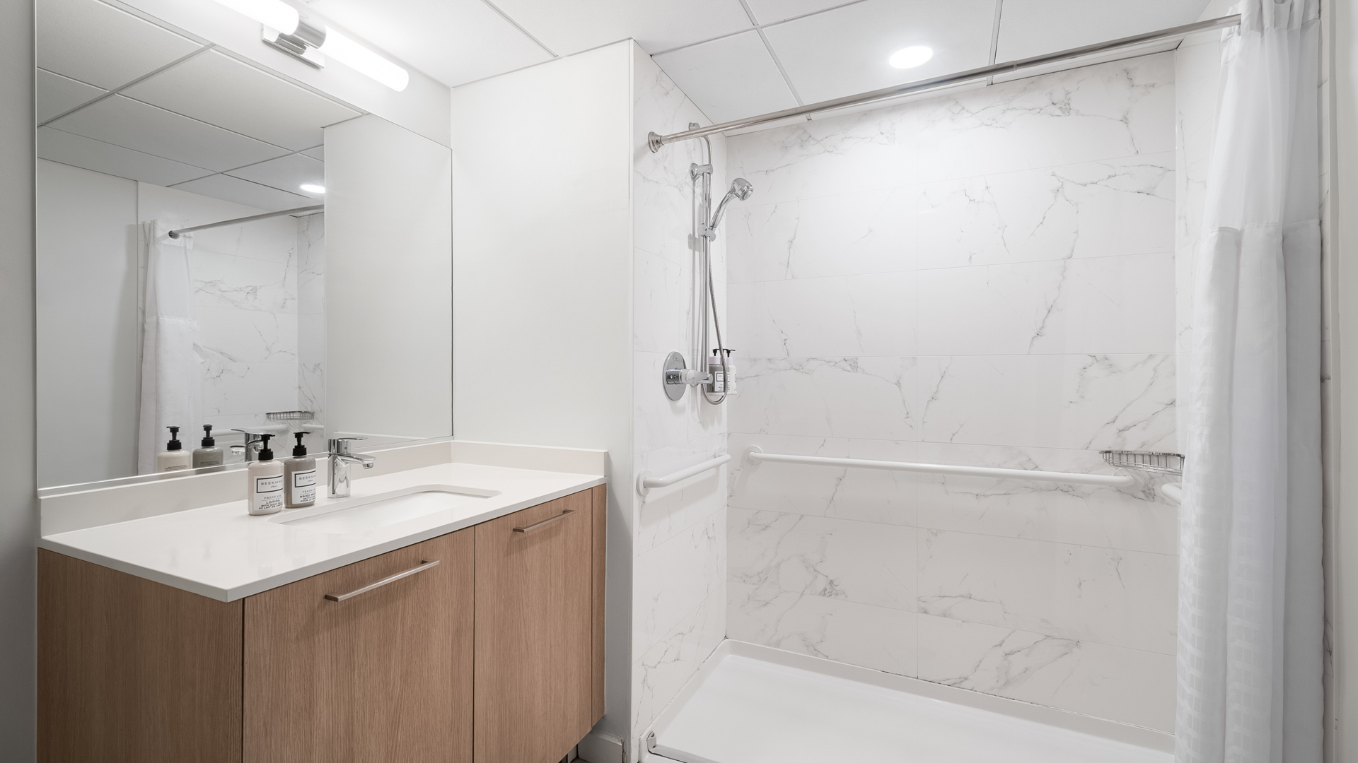 a bathroom with a shower and sink