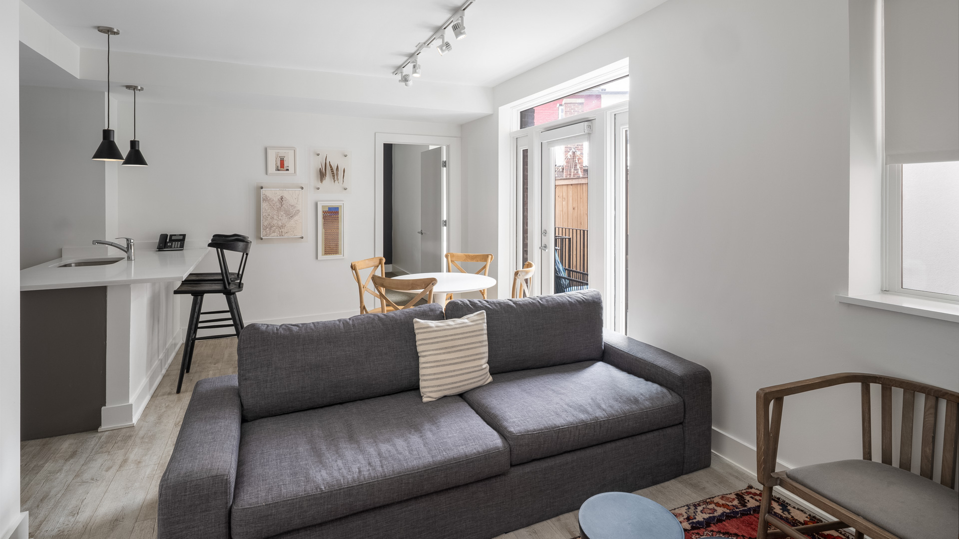 a living room with a couch and dining table
