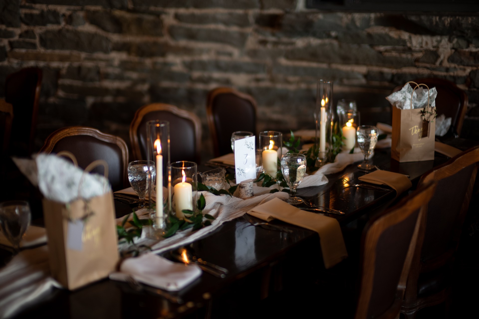 a table with candles and glasses