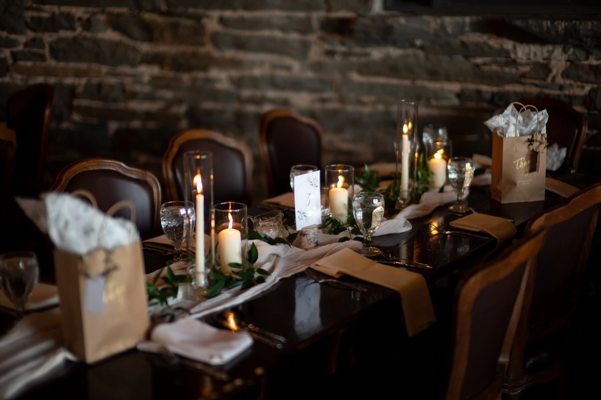 a table with candles and glasses