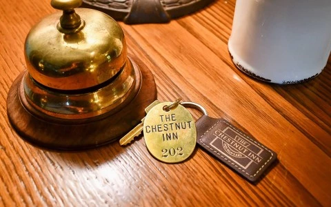 a keychain with a leather tag on a table