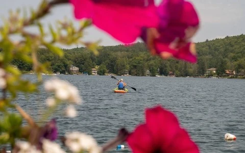 a person in a kayak on a lake