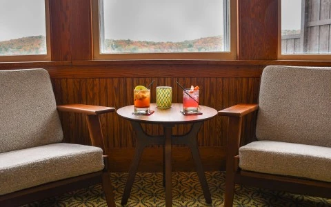 two chairs next to a table