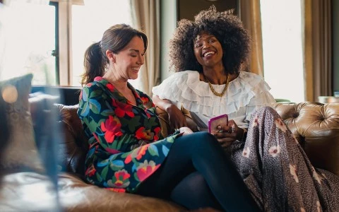 a group of women sitting on a couch