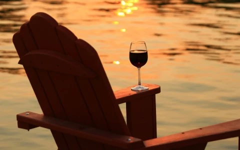 a glass of wine on a chair