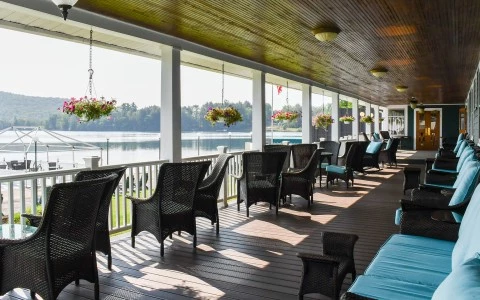 a patio with chairs and a bench