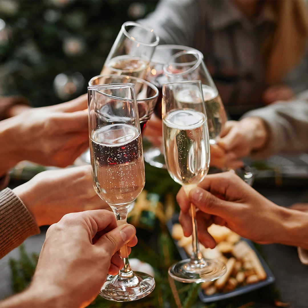 a group of people holding champagne glasses