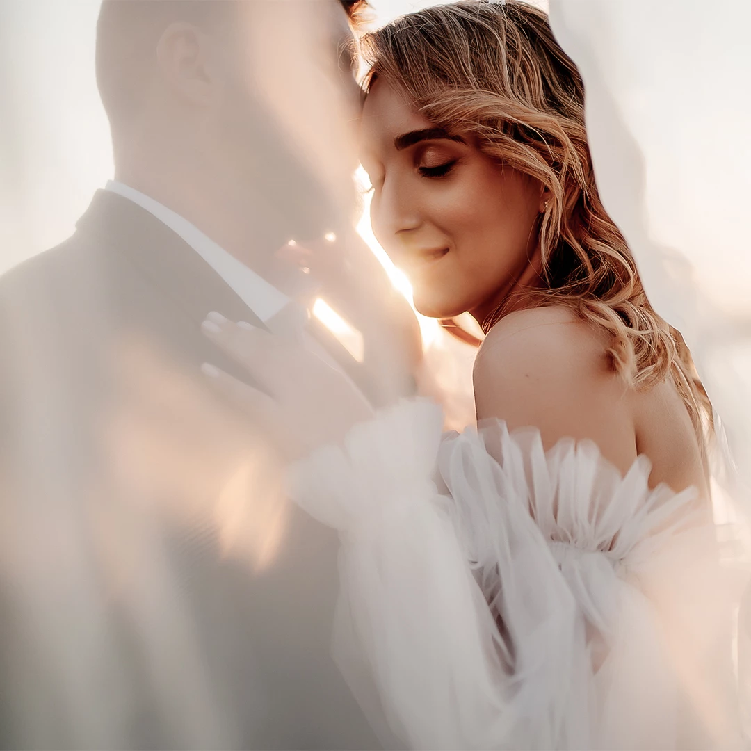a man and woman in a white dress
