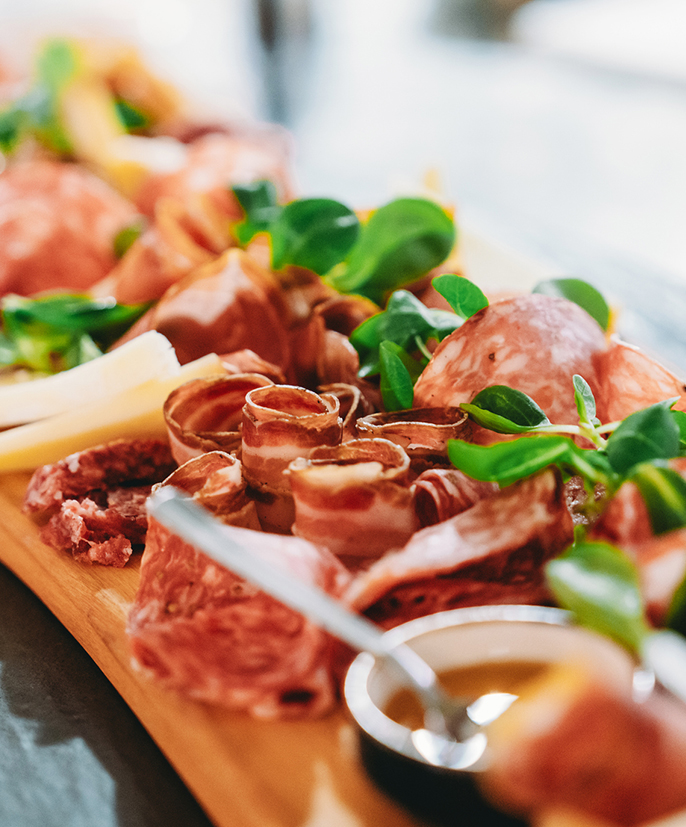 a platter of meat and cheese