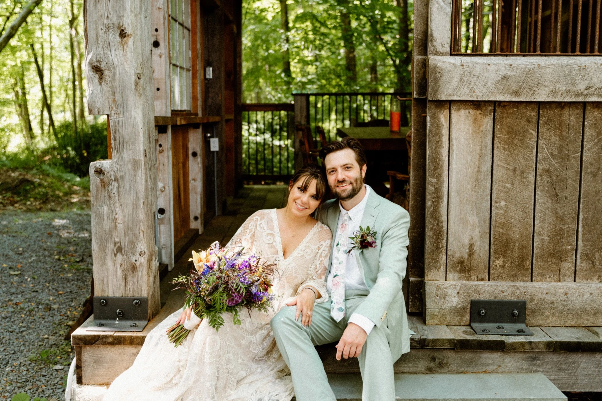 a man and woman sitting on stairs