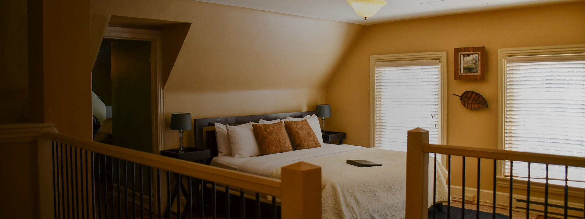 a bed with pillows and a book on it