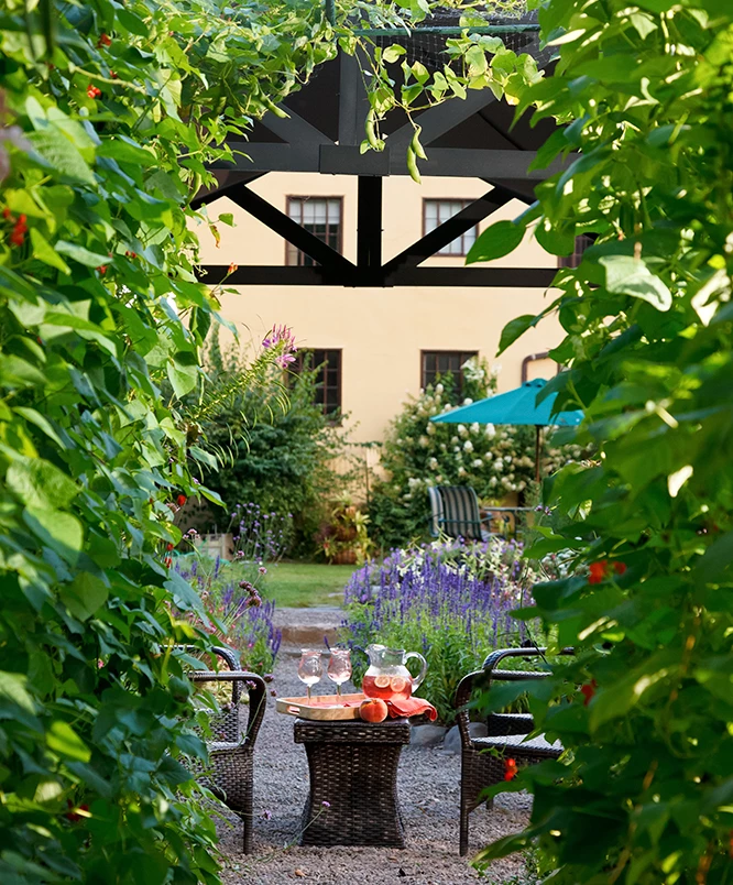 a table and chairs in a garden