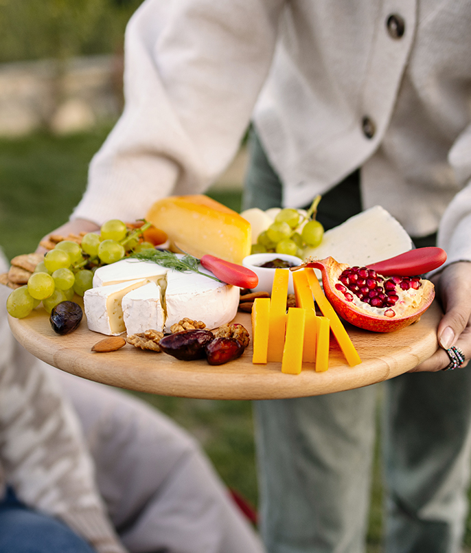 a person holding a plate of food