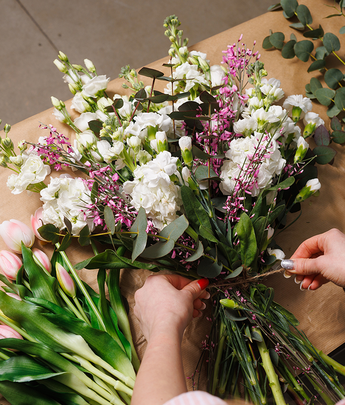 a person holding a bouquet of flowers