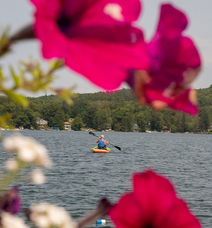 a person in a kayak on a lake