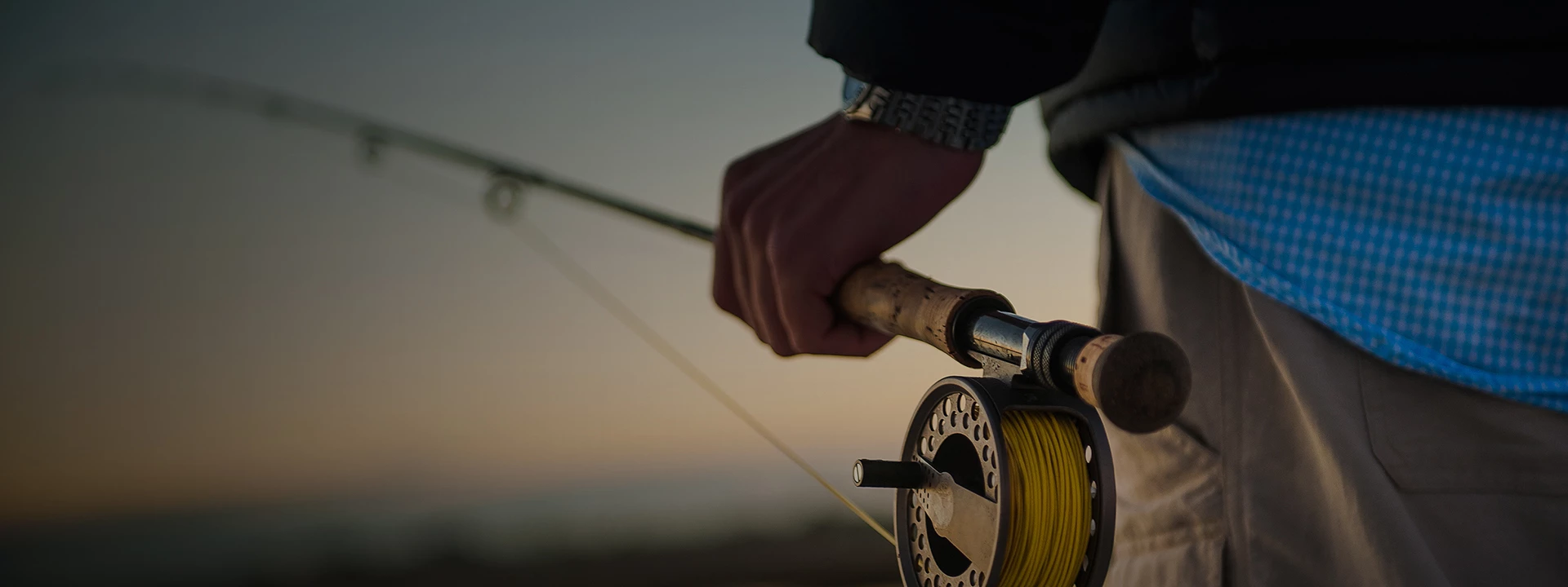 a person holding a fishing pole