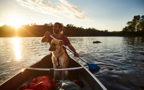 canoe tour with a dog and a man