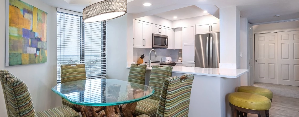 a dining table and chairs in a kitchen