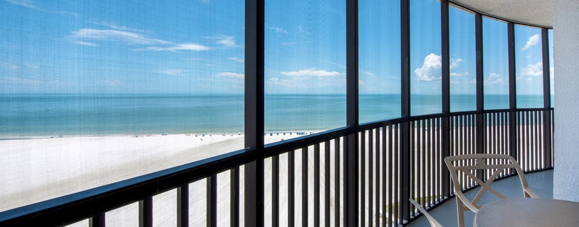 a balcony with a view of the beach